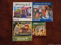 Top-down view of all four boxed puzzles