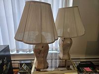 Front view showing both stone-look lamps with shades in place