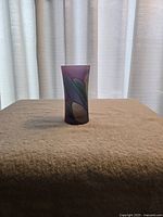 Front view of frosted multicolor art glass vase on tabletop