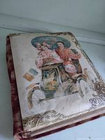 Front cover showing velvet spine, chromolithograph image, gilt corners