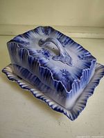 Covered cheese keeper showing lid on base