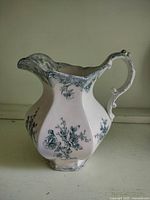 Full view of jug showing shape, handle and blue transfer floral design