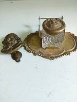 Inkstand and door knocker side by side