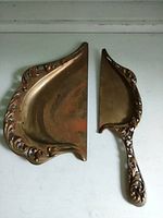 Crumb tray and scraper showing full design and patina