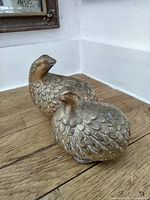 both brass pheasant figurines showing full form and feather detail