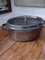 Oval Staub roaster with lid on, showing overall appearance