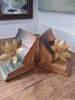 Front view of both Roseville floral bookends set together