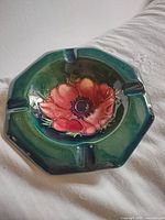 Top view showing ashtray shape, floral decoration, and glaze