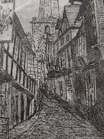 Close view of lower section showing cobblestone lane and buildings