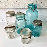 Group shot of all six jars showing colors, sizes, and closures