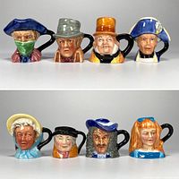 Eight character jugs front view