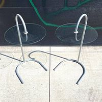 Pair of Ikea Ry side tables front view showing glass tops and silver frames