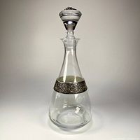 Full view of crystal decanter with stopper in place