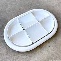 assembled tray with inserts and two lidded pieces visible