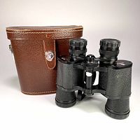 Front view of binoculars and leather case