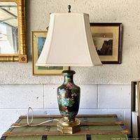 Lamp with shade on trunk showing overall form and size