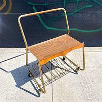 Front view showing wood shelf, metal frame and rack