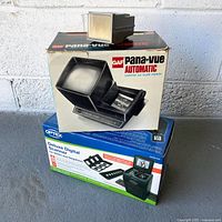 Boxes of GAF Pana-Vue Automatic viewer and Optex Digiscan 2 scanner