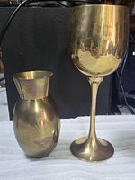 Goblet and vase side by side