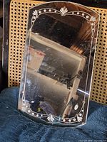 Front view showing etched floral border and overall shape