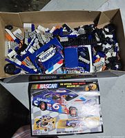 Loose bricks, wheels, instructions inside cardboard box
