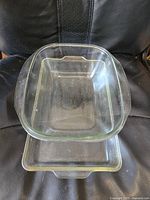 Two clear Pyrex glass baking dishes stacked