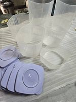 All six translucent containers and stacked lavender lids