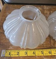 Single shade with tape measure showing 6 in. width