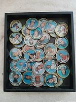 Tray containing approximately 34 Topps 1987 baseball picture coins