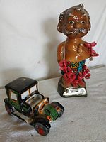 Both decanters—figurine and car—group view