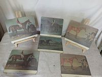 Six Lady Claire racehorse prints displayed