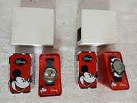 Both watch sets with tins and boxes displayed