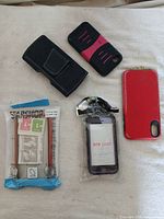 Group shot of five visible phone cases on white surface