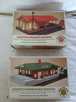 Front view of both boxed stations showing product names and Bachmann logo