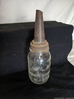 Full view of Atlas Strong Shoulder Mason jar with attached metal spout