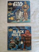 Front view of both book-and-record sets: Star Wars and The Black Hole