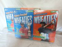 Front view showing two box designs, honey frosted and low fat versions