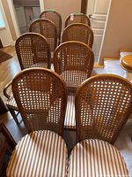 All eight chairs lined in two rows showing backs and seats