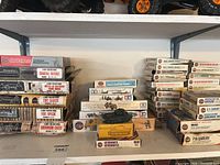 Full shelf view showing multiple Airfix boxed sets and built tank