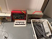 boxed controllers, ore wagon set box, track booklet and basket of track