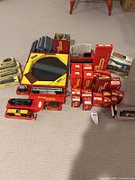 assortment of Tri-ang boxed items, Rovex coaches, turntable and loose rolling stock laid out