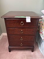 Nightstand left side view showing drawers and hardware