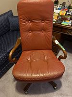 Front view of leather office chair showing overall design and condition