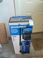 Box showing Simoniz 1700 PSI electric pressure washer details