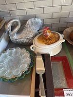 Overall lot—swan server, hen tureen, stacked plates, boxed servers