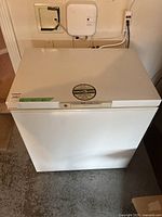 Front and top view of white chest freezer