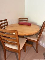 Overall view of round table and four matching chairs