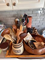 Overview of tray with salad bowl, crock, utensils