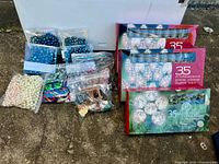 Group shot showing boxed light sets, garland packs, bead strand, ornament bags