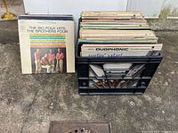 Front record in crate showing The Brothers Four album and crate of LPs